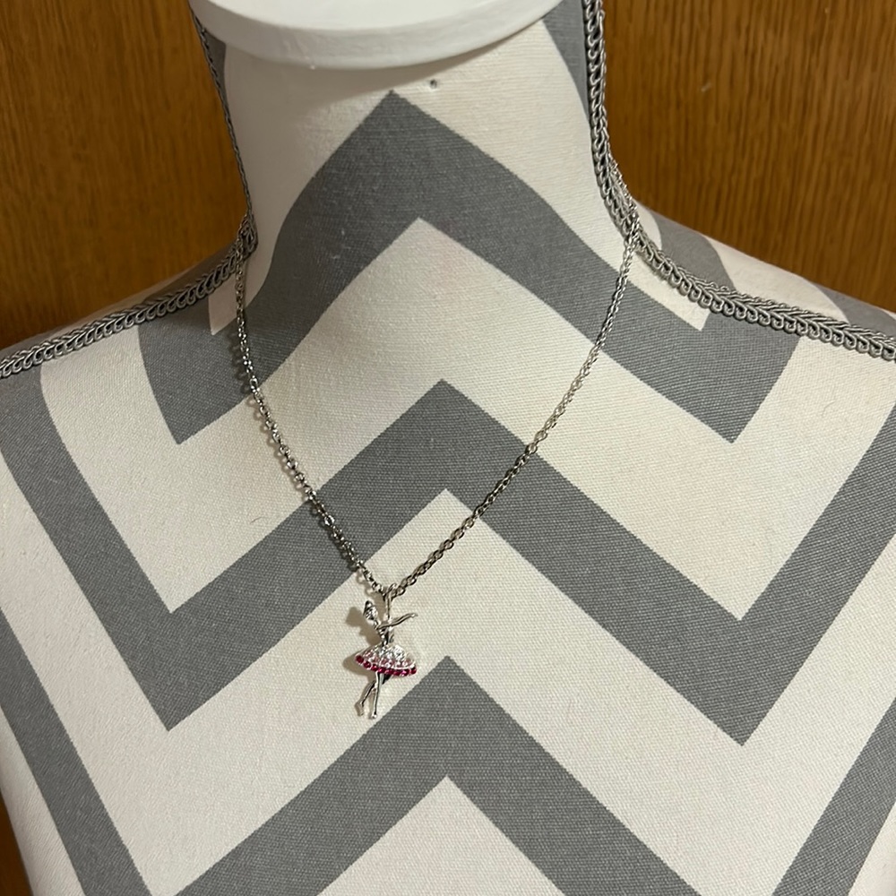 Kids 16” silver necklace with a 1.5” ballerina pendant. Gently used.